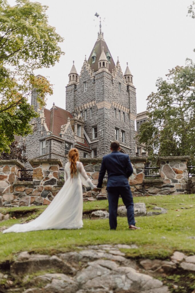 bride and groom in front of Boldt Castle Elopement