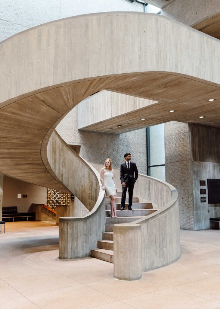 couple on Everson Art Museum stairs for art museum engagement session 
