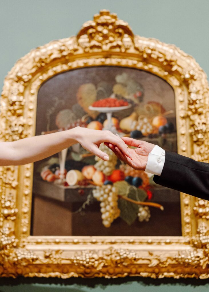 Everson art museum engagement session hands in front of painting