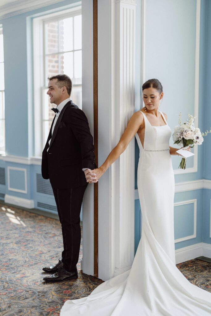 bride and groom first touch at Hotel Syracuse