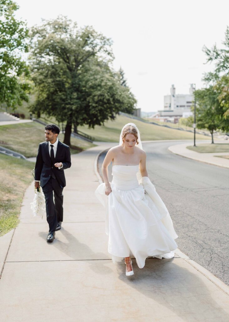 bride and groom walking during Syracuse, NY wedding