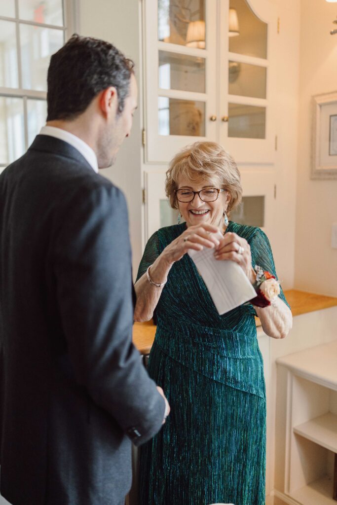 Grandma giving groom a gift