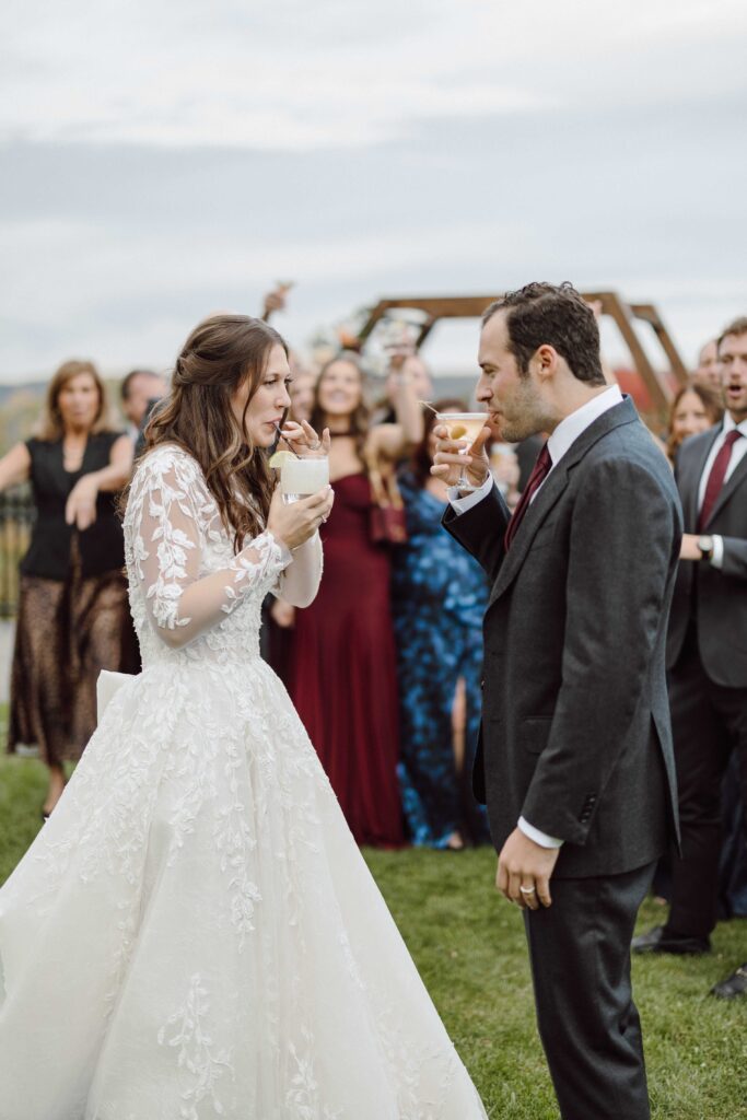 bride and groom with family behind them