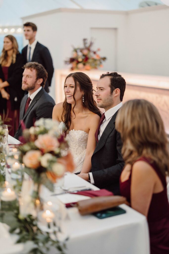 bride and groom listening to speeches at Inn at Taughannock Falls wedding