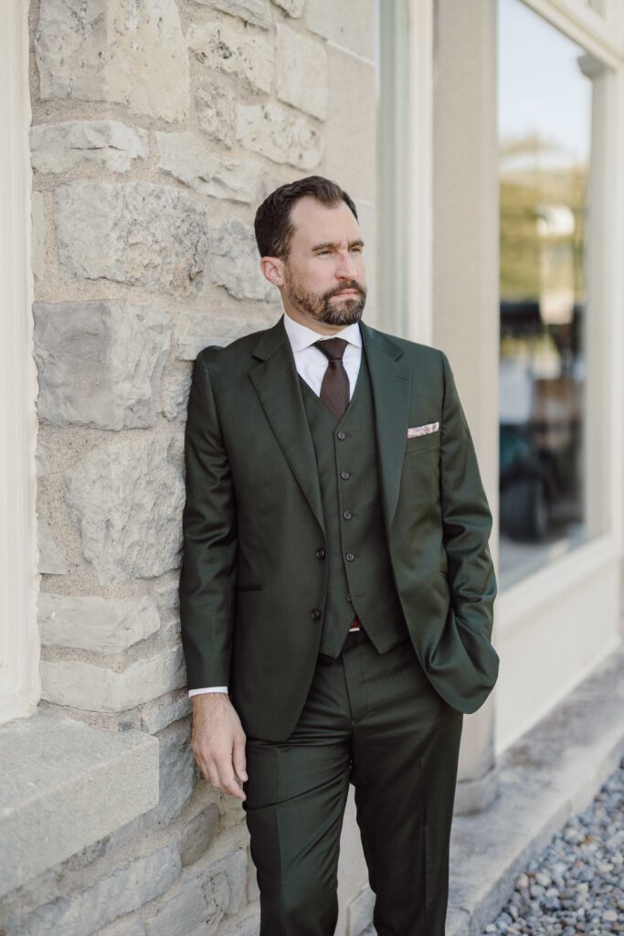 groom in green suit
