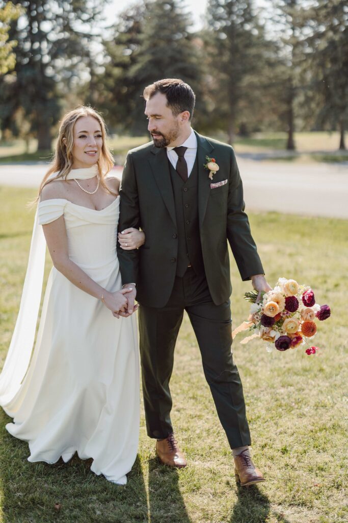 bride and groom walking at Onondaga Country Club wedding