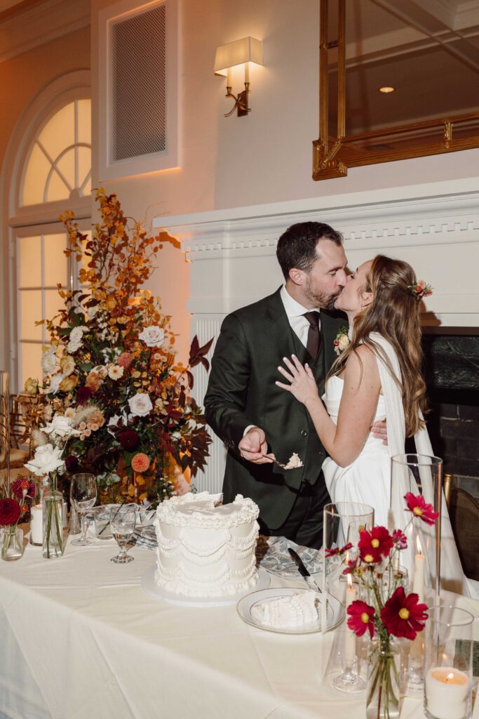 cake cutting on wedding day at ballroom at Onondaga Country Club