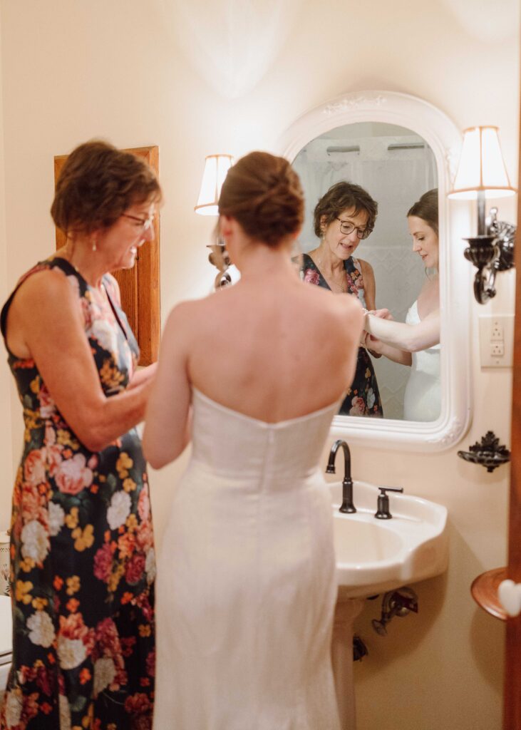 bride getting ready in vintage bathroom