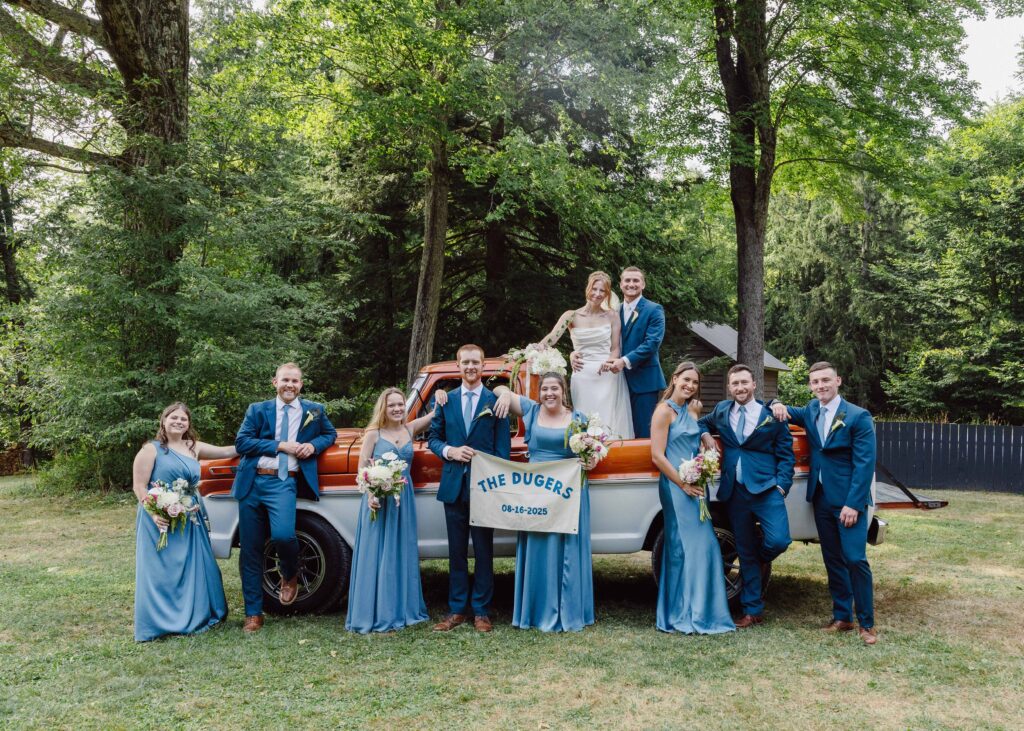 wedding portraits with rustic truck wedding party